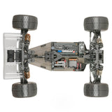 Tekno ET410.2 1/10th scale 4WD electric RC truggy kit on a track, showcasing its chassis and off-road tires.