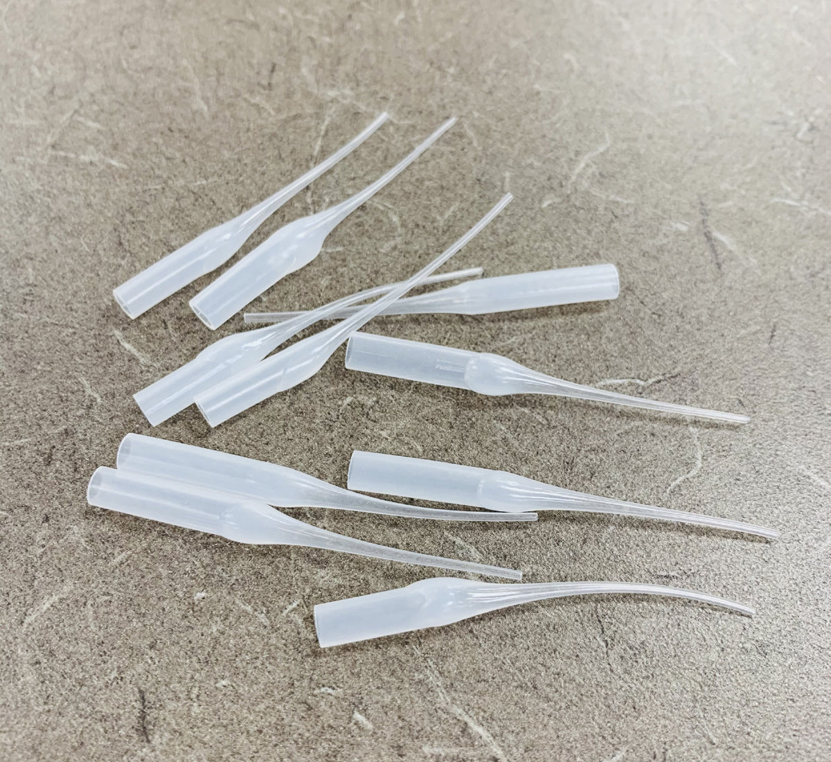 Set of 10 Racers Edge Crazy Strong Tire Glue Tips for RC cars, designed for precise application and secure tire attachment.